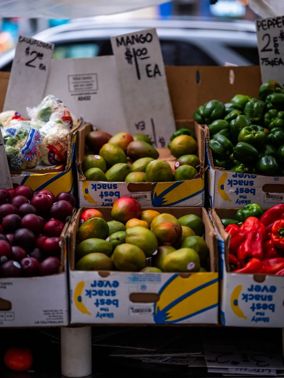 Local market stall selling fresh tropical fruits and spices
