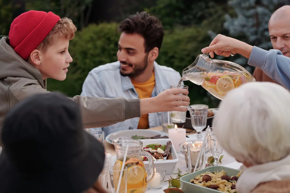A group of people enjoying an Awadhi meal together at a communal table