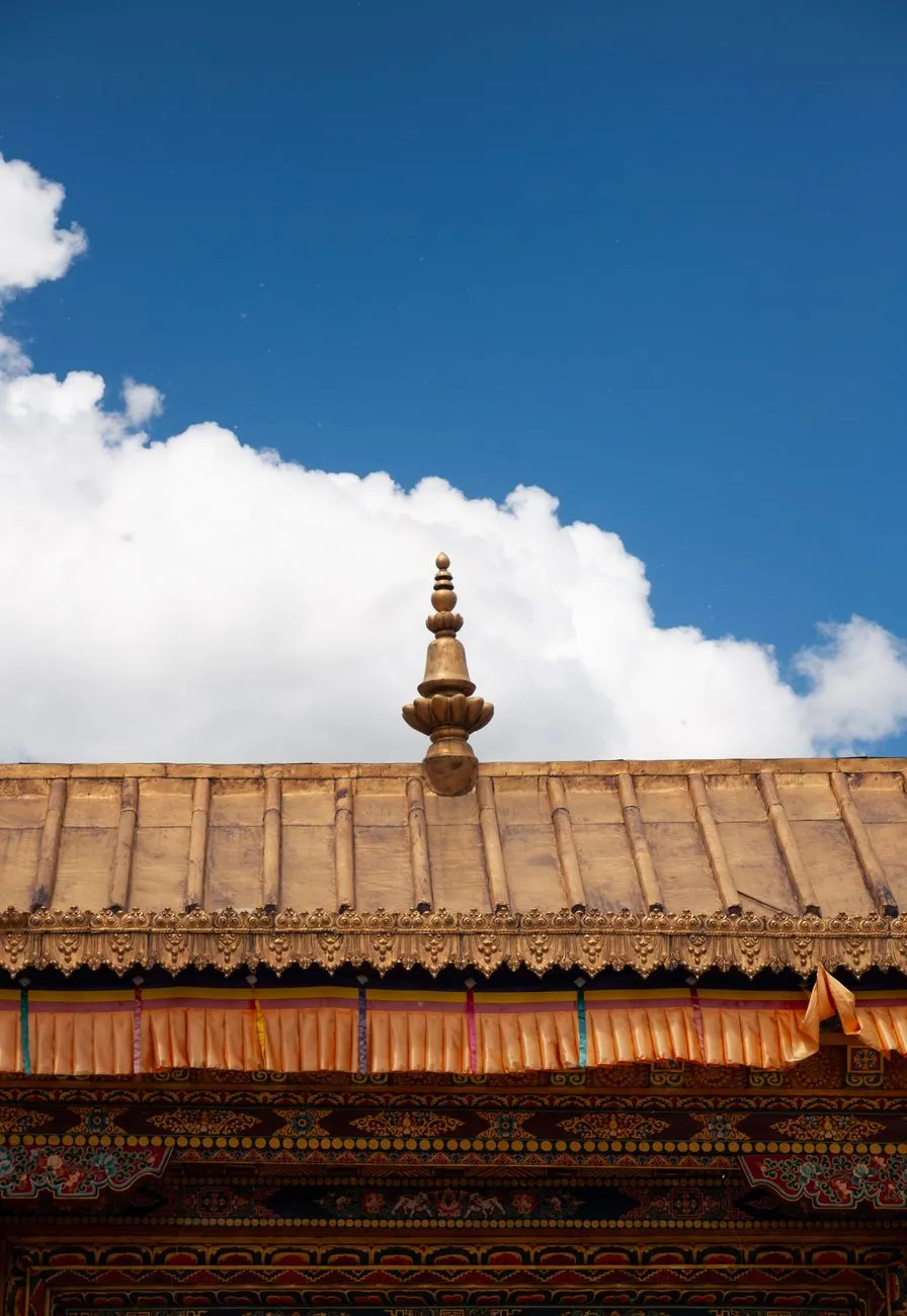 Close-up of the ornate wooden carvings and murals inside Paro Taktsang Monastery, Bhutan