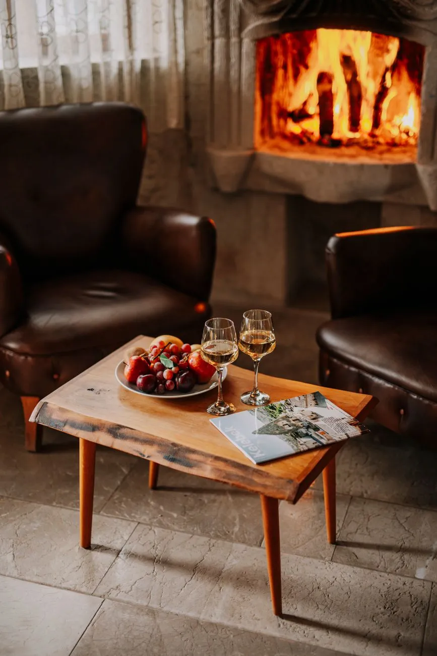 Interior of a luxury cave hotel room with carved stone walls and modern furnishings