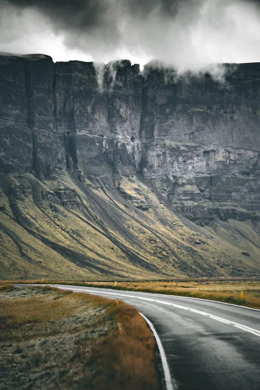 Iceland Ring Road scenic highway with waterfall and mountains