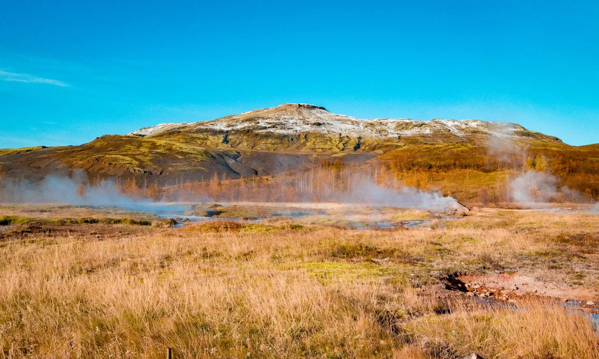 Icelandic hot spring with steam rising