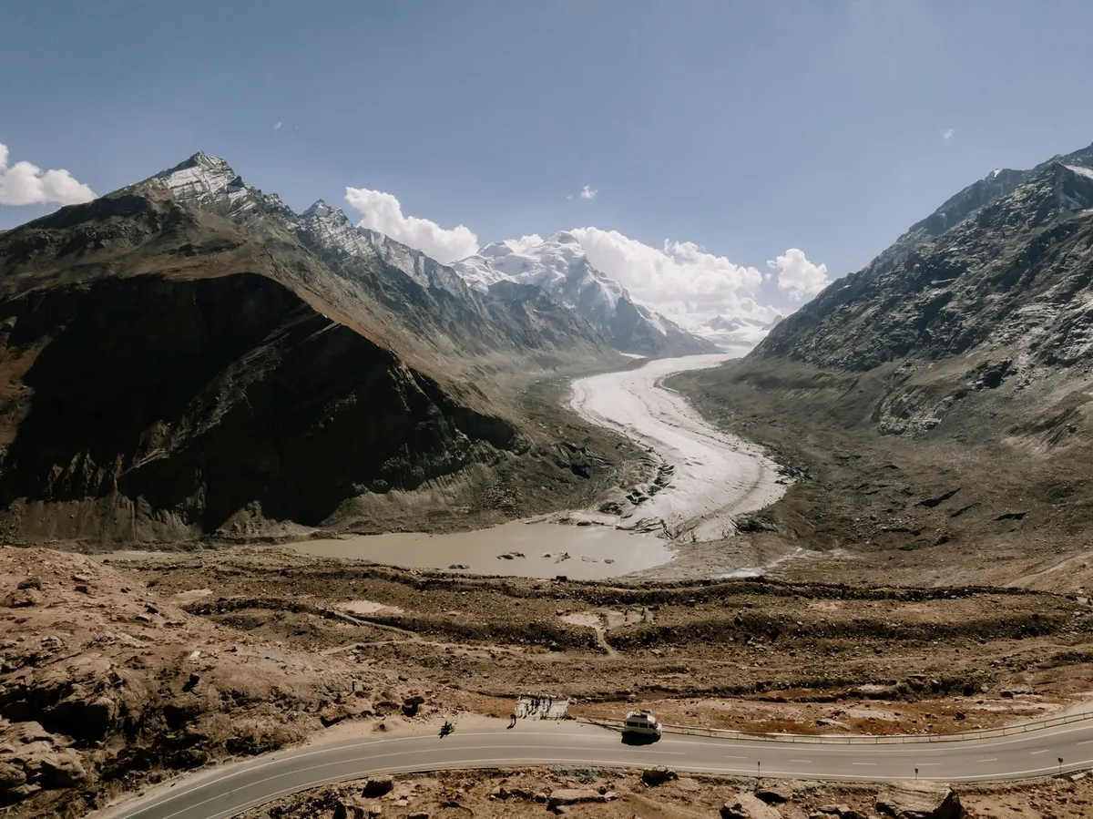 Cross‑border bus on mountain road