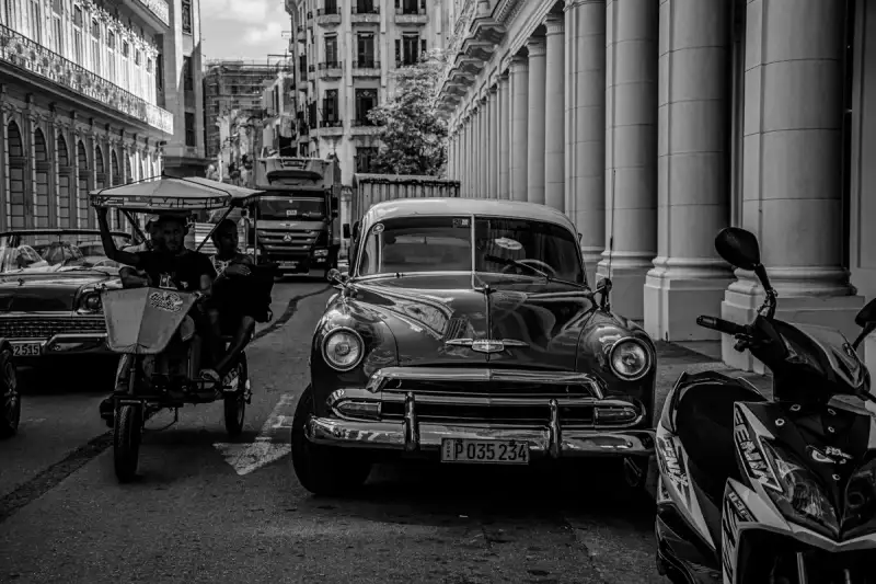 Traditional Cuban street scene with people enjoying drinks