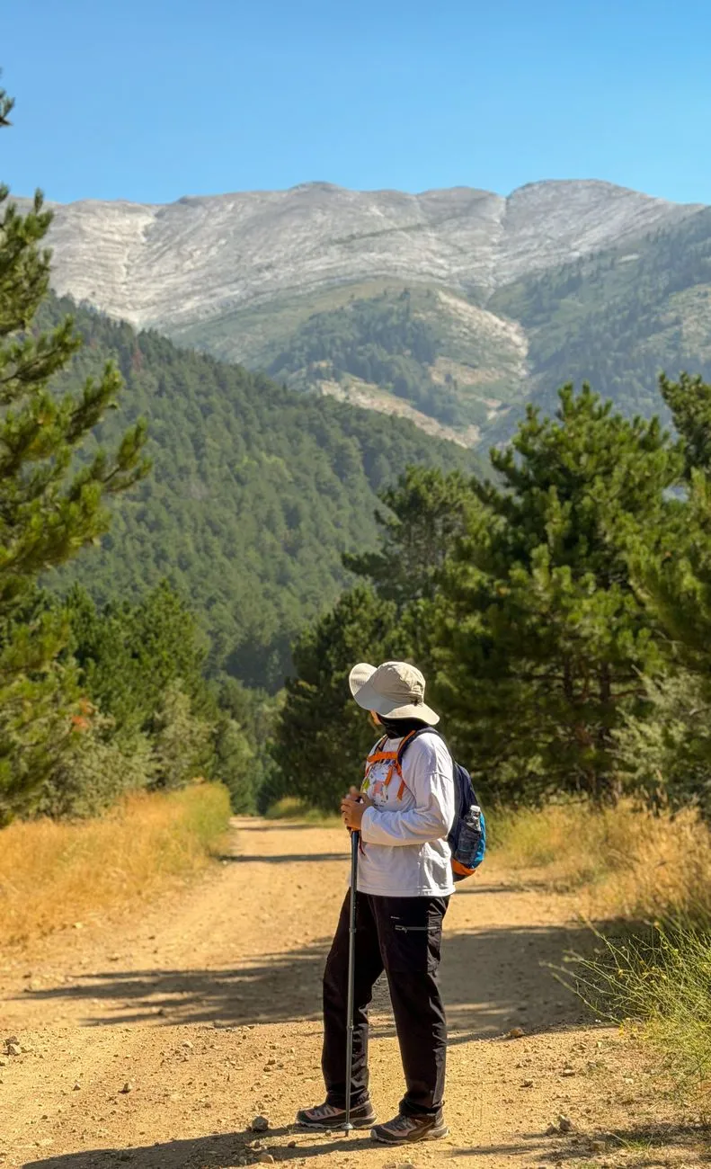 Hiker on the trail to a Meteora monastery