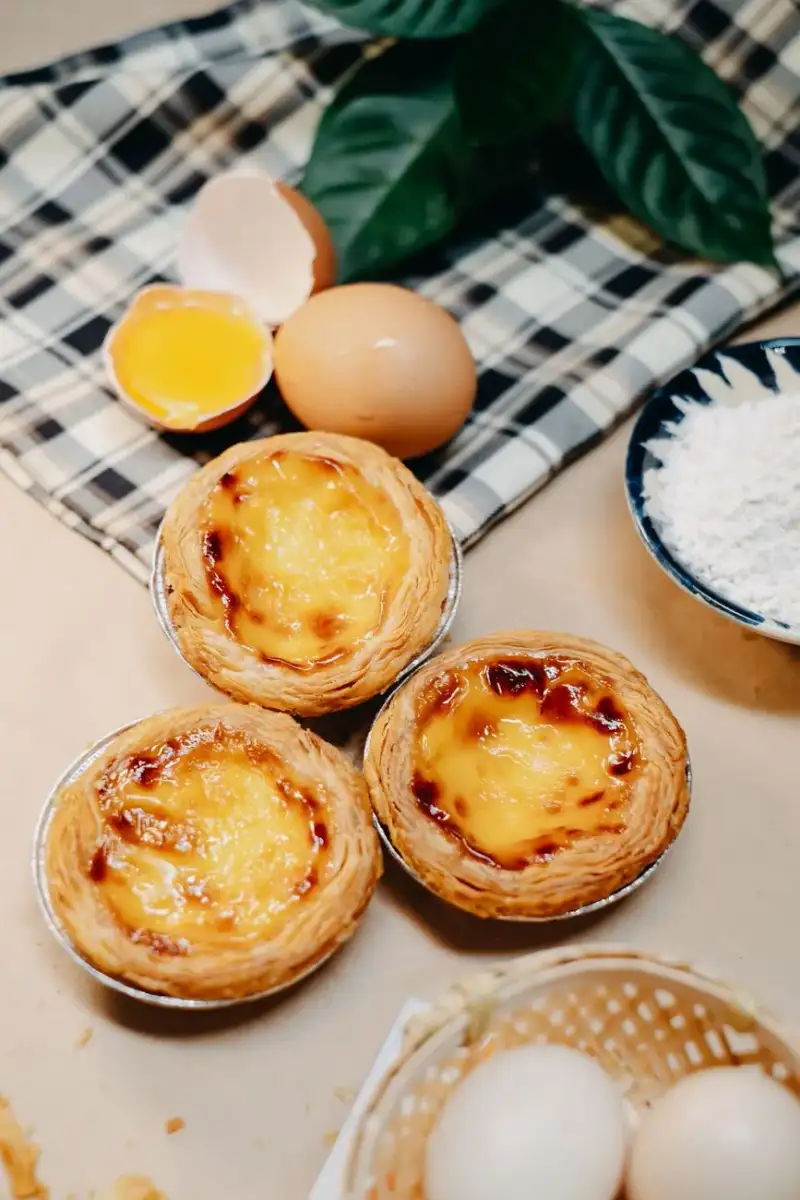 Egg Tarts being enjoyed in a modern cafe