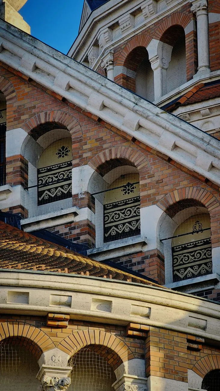 Intricate geometric brick patterns on an ancient tower