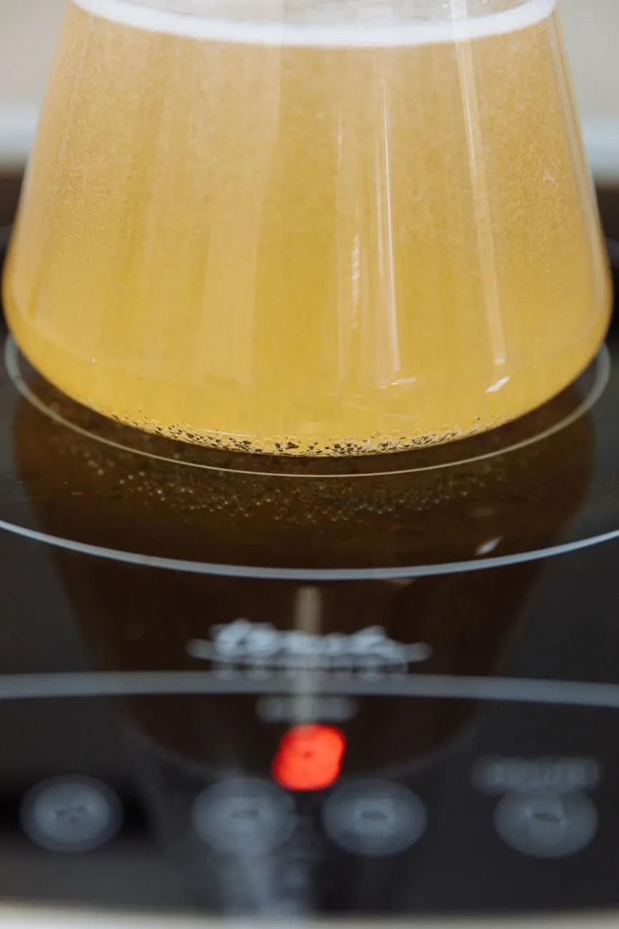 SCOBY formation in a glass jar