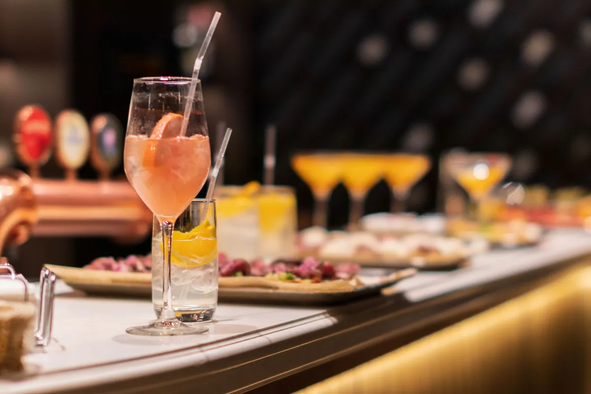 A vibrant pintxos bar with an array of colorful skewered bites on toothpicks