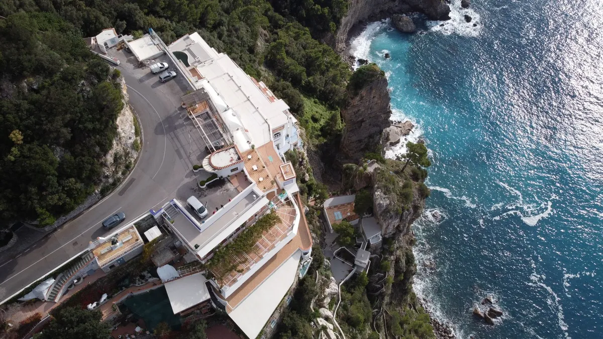 Amalfi Coast cliffside road with pastel villages and turquoise water