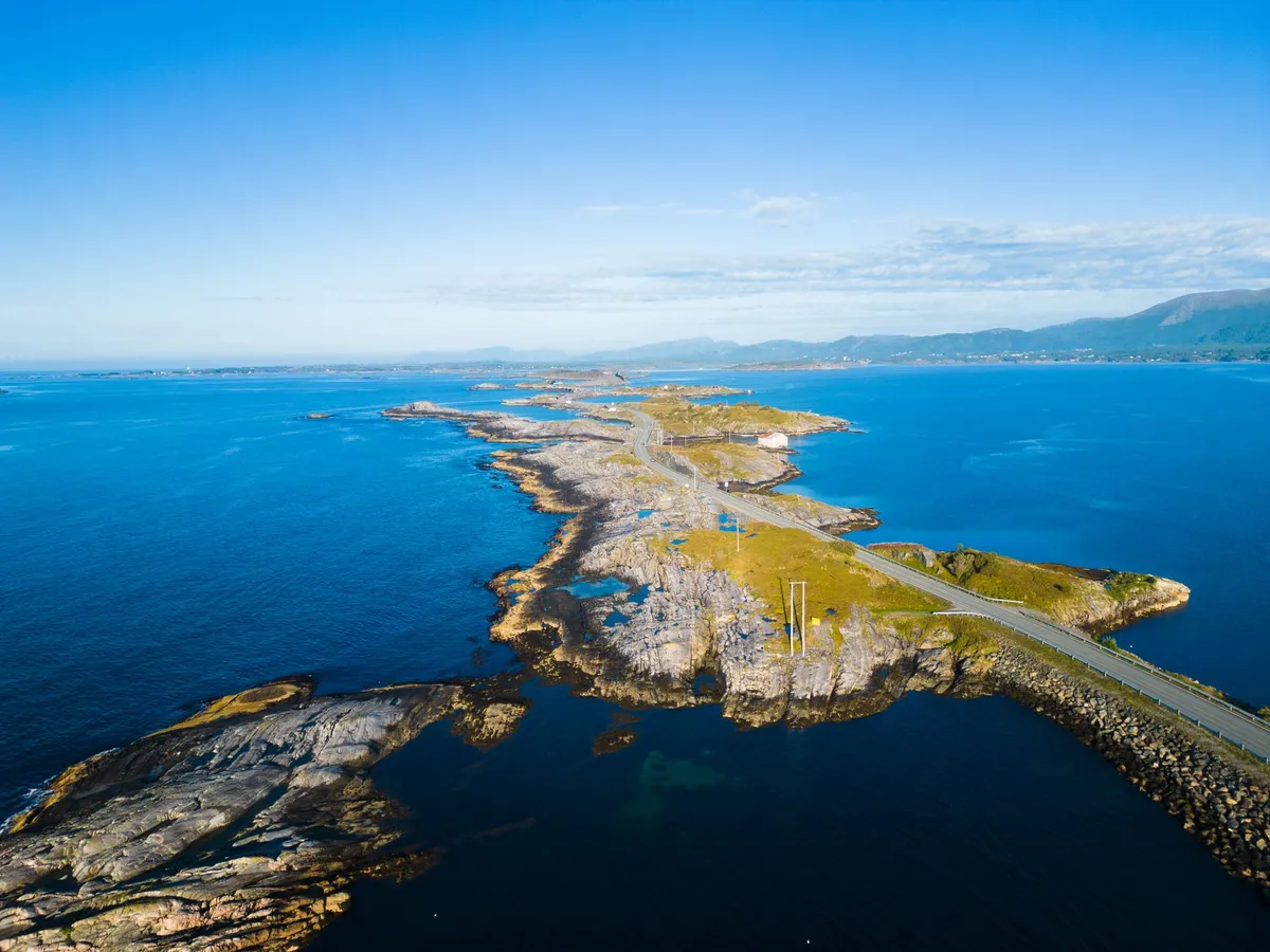 Norwegian coastal road with dramatic bridges and North Sea waves