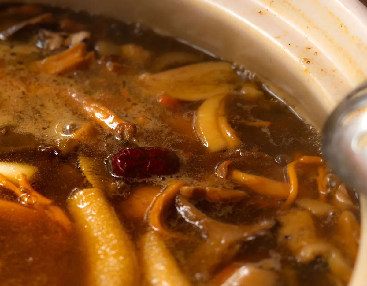 Mushroom powder sprinkled over broth