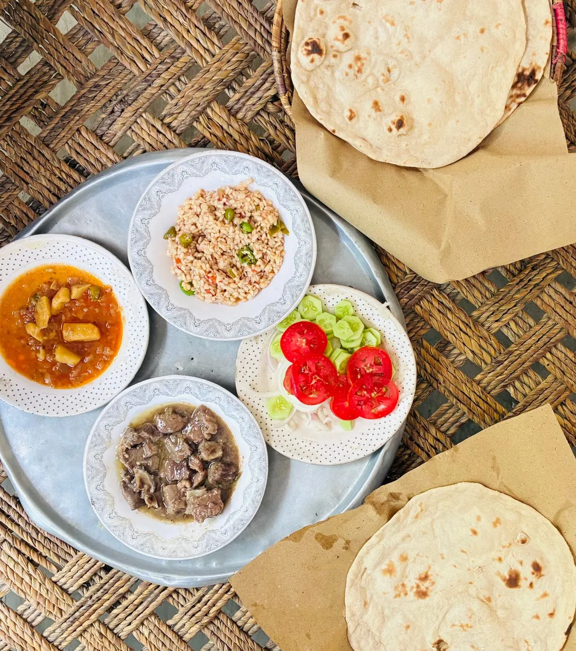 A traditional Ethiopian platter with injera, doro wat, and various stews