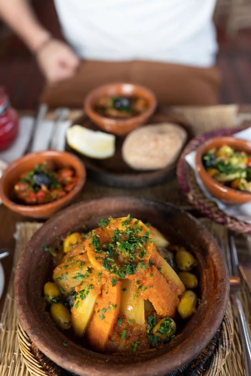 A traditional Moroccan tagine with lamb, prunes, and almonds