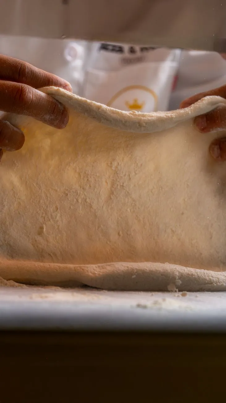 Hand-stretched Neapolitan pizza dough