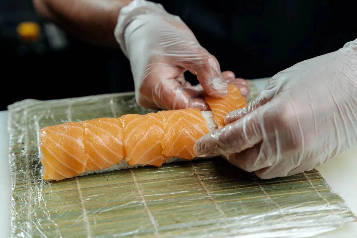 A chef preparing sushi at a Michelin-starred restaurant in Tokyo