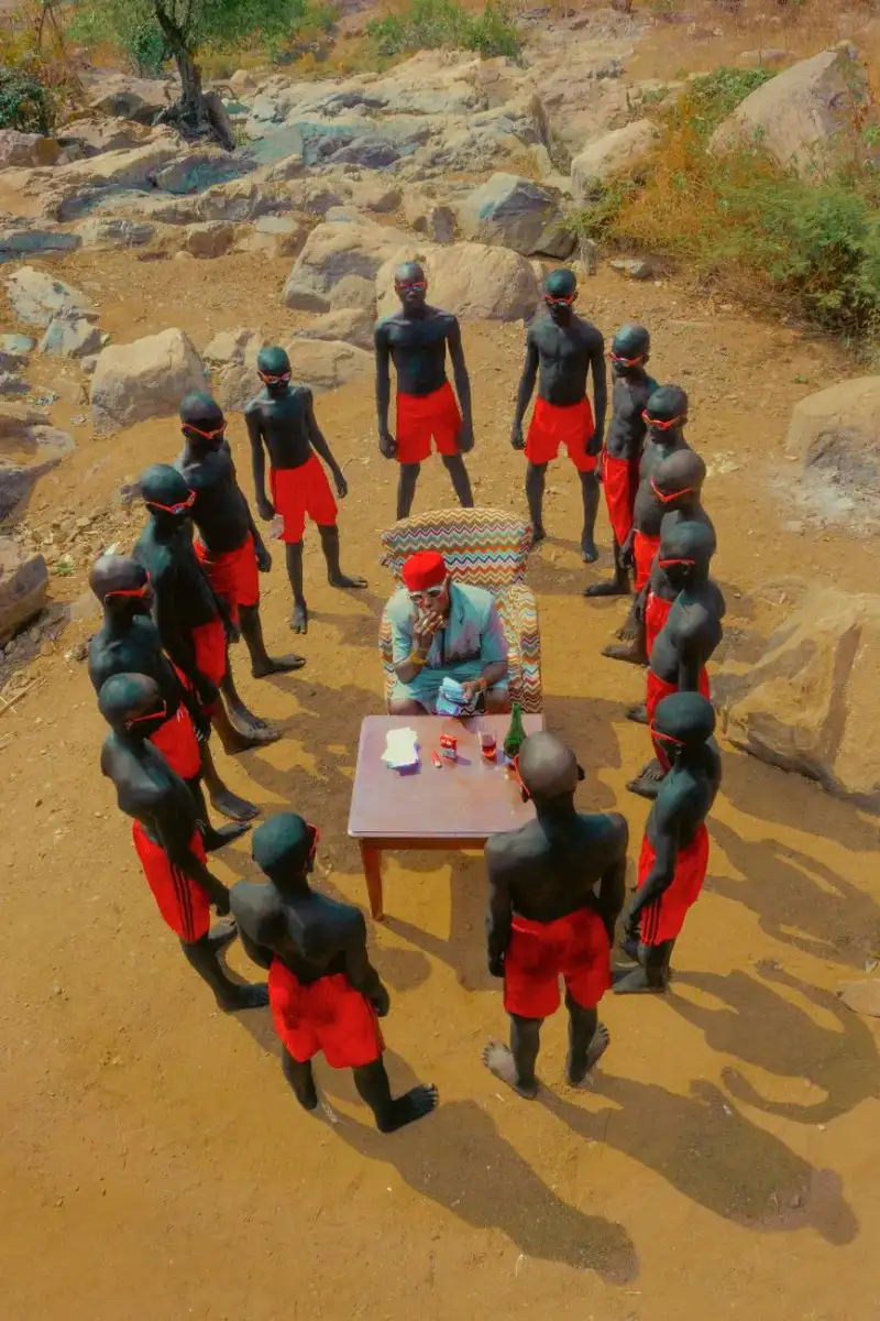 An elder storyteller captivating a group of diverse children by firelight, with shadows dancing on ancient cave walls, evoking traditional oral narratives and the origins of storytelling.