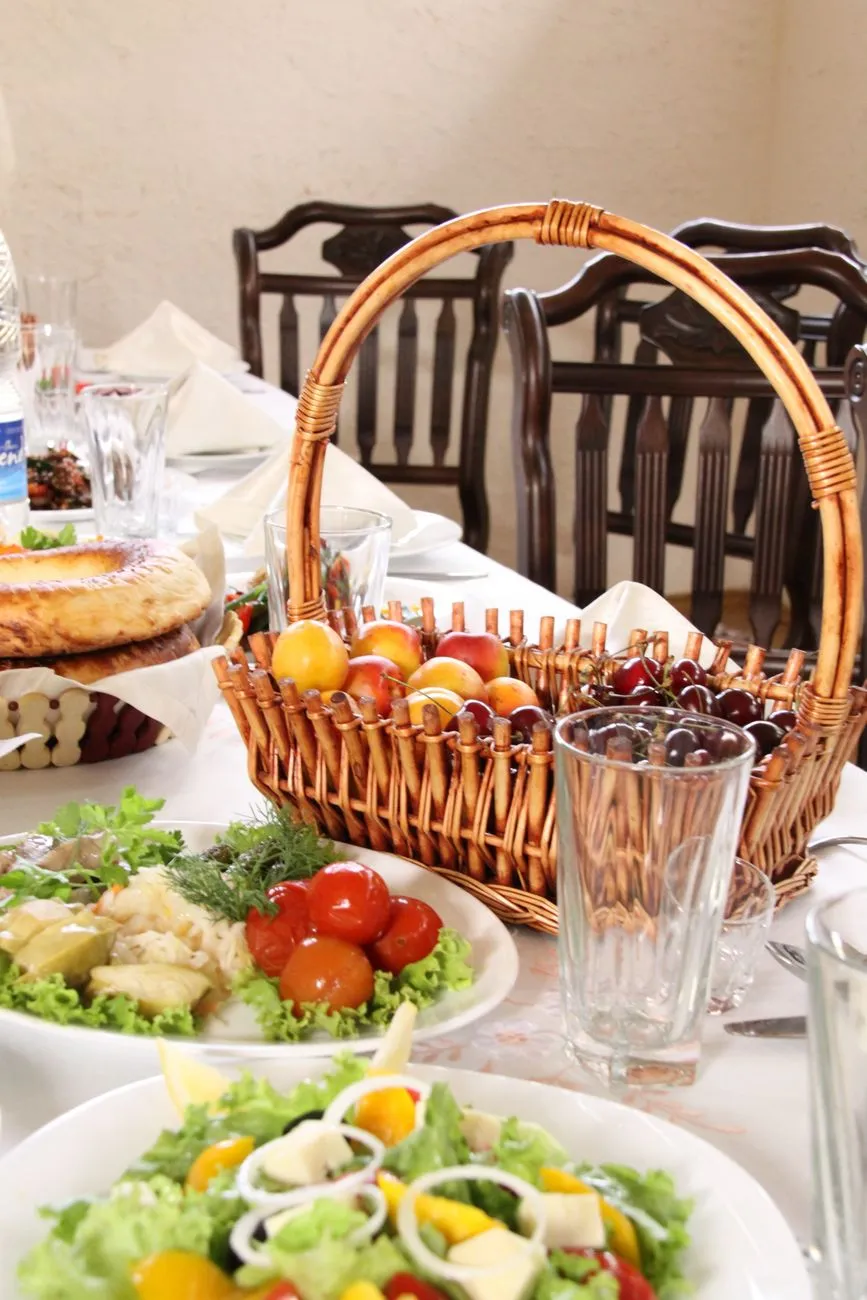 Traditional Georgian feast with khachapuri, khinkali, and wine on a wooden table