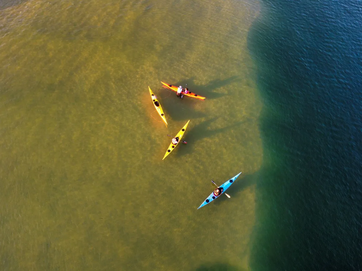 Kayak on misty lagoon