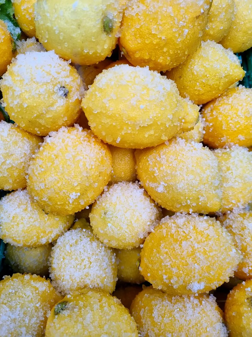 Salt-cured citrus on a rustic Sicilian table