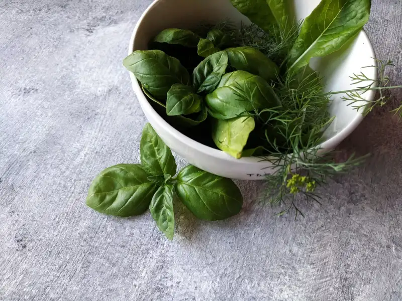 An assortment of fresh herbs used in Goi Cuon preparation
