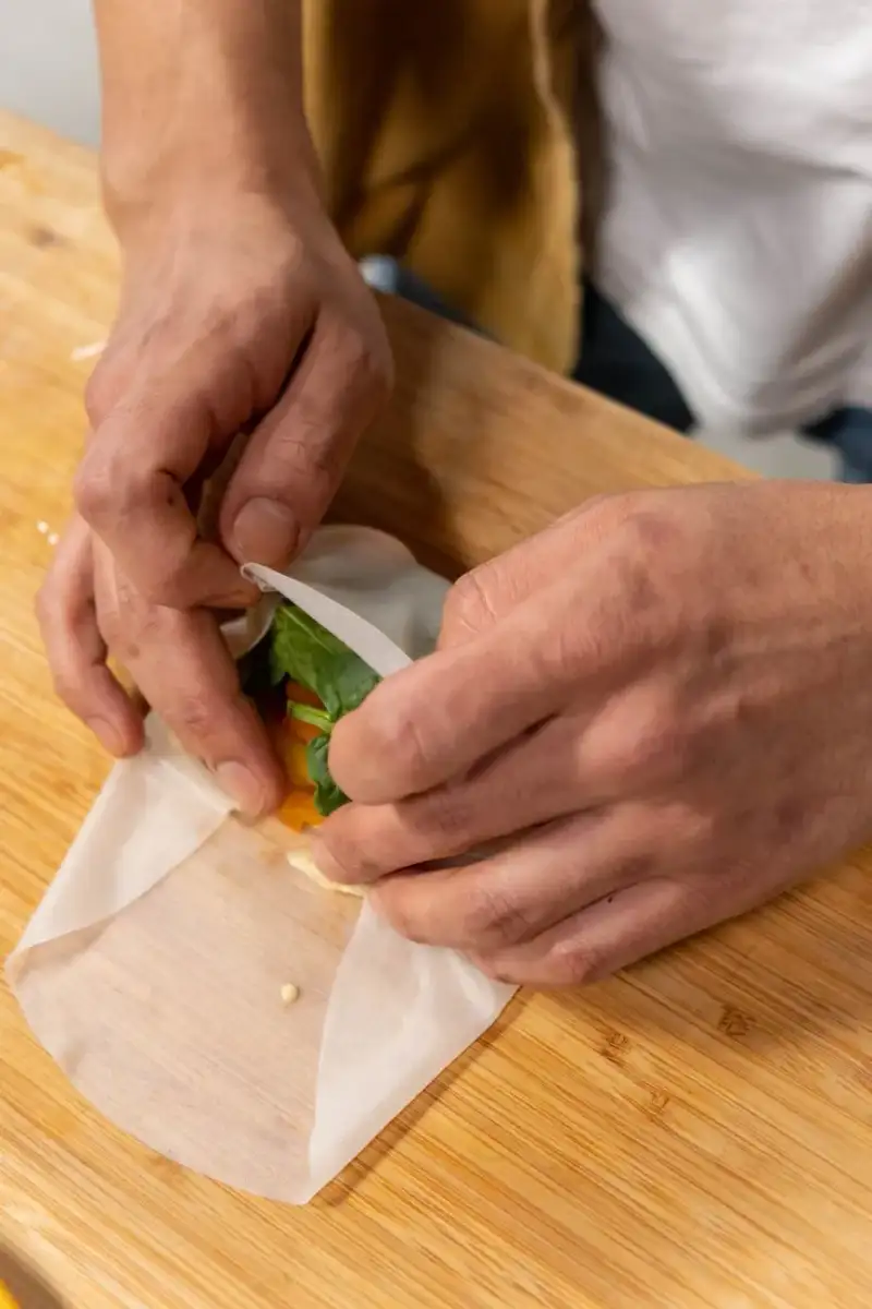 Close-up of Goi Cuon being wrapped, showcasing its delicate layers