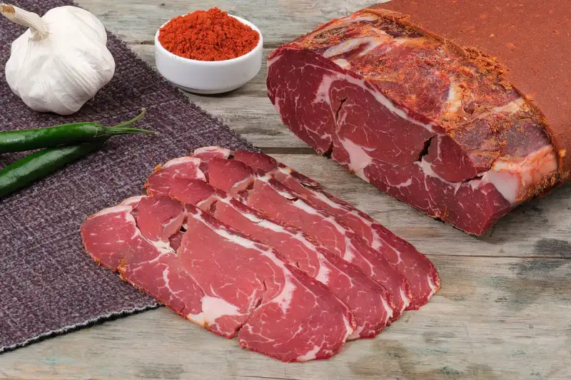 Spiced meat filling being cooked in a pan