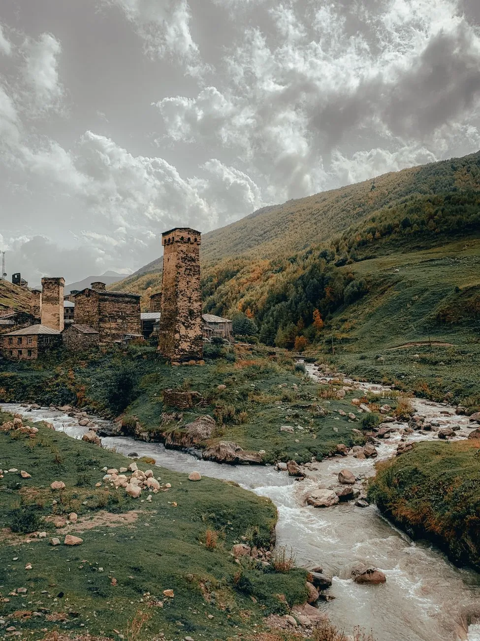 Medieval stone towers against a dramatic sky