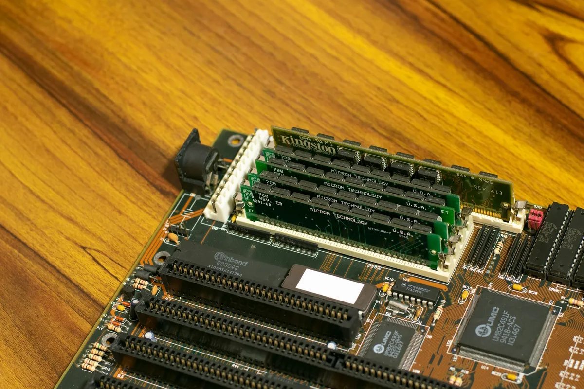 Close-up of a spatial light modulator (SLM) chip with microscopic pixel arrays, used to modulate light phase
