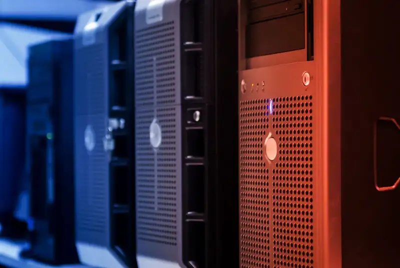 A detailed shot of a Raspberry Pi cluster and network switch in a home server rack