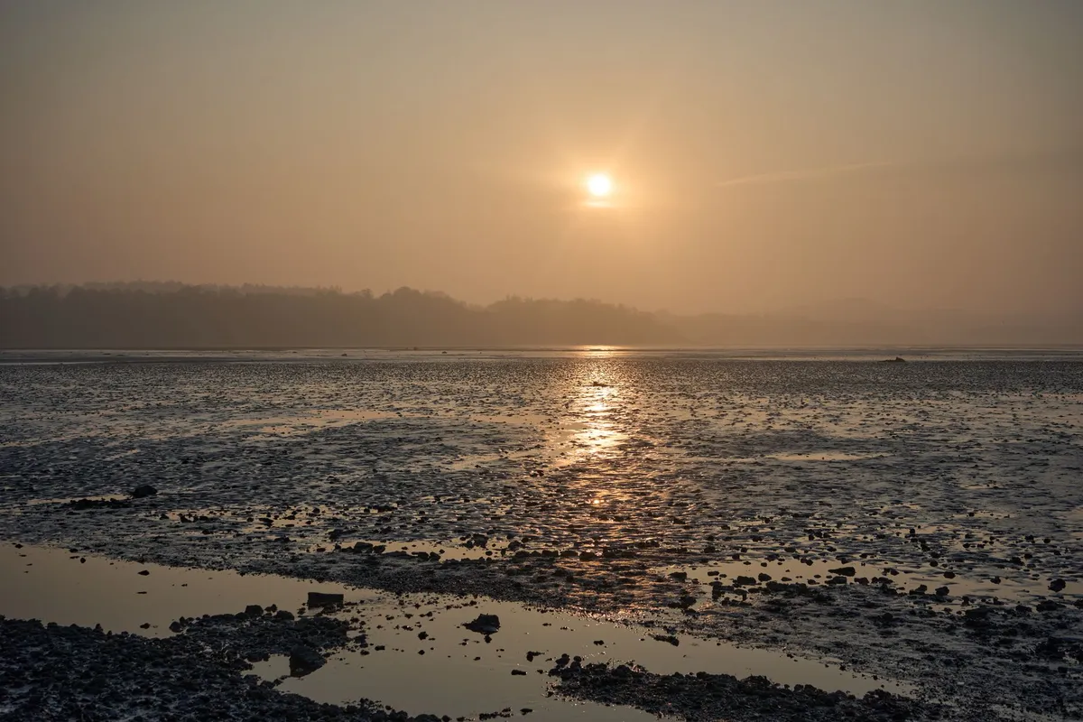 View of the abbey walls reflecting in the tide