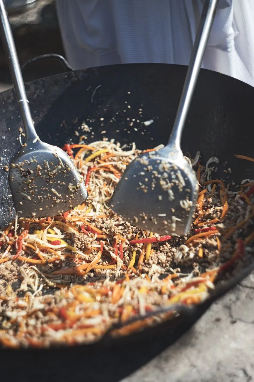 Wok cooking with flames