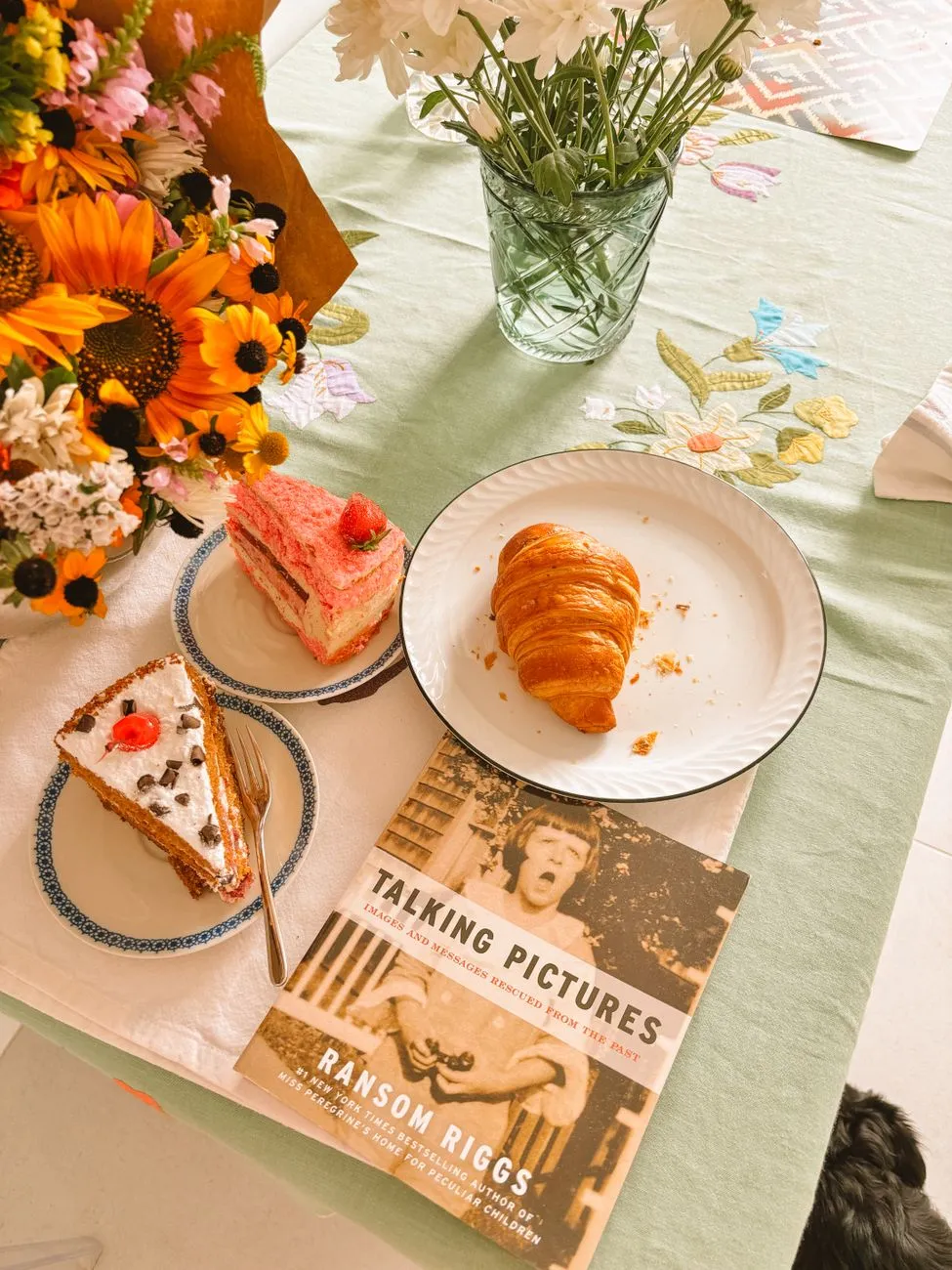 Vintage cookbook and scientific instruments on wooden table