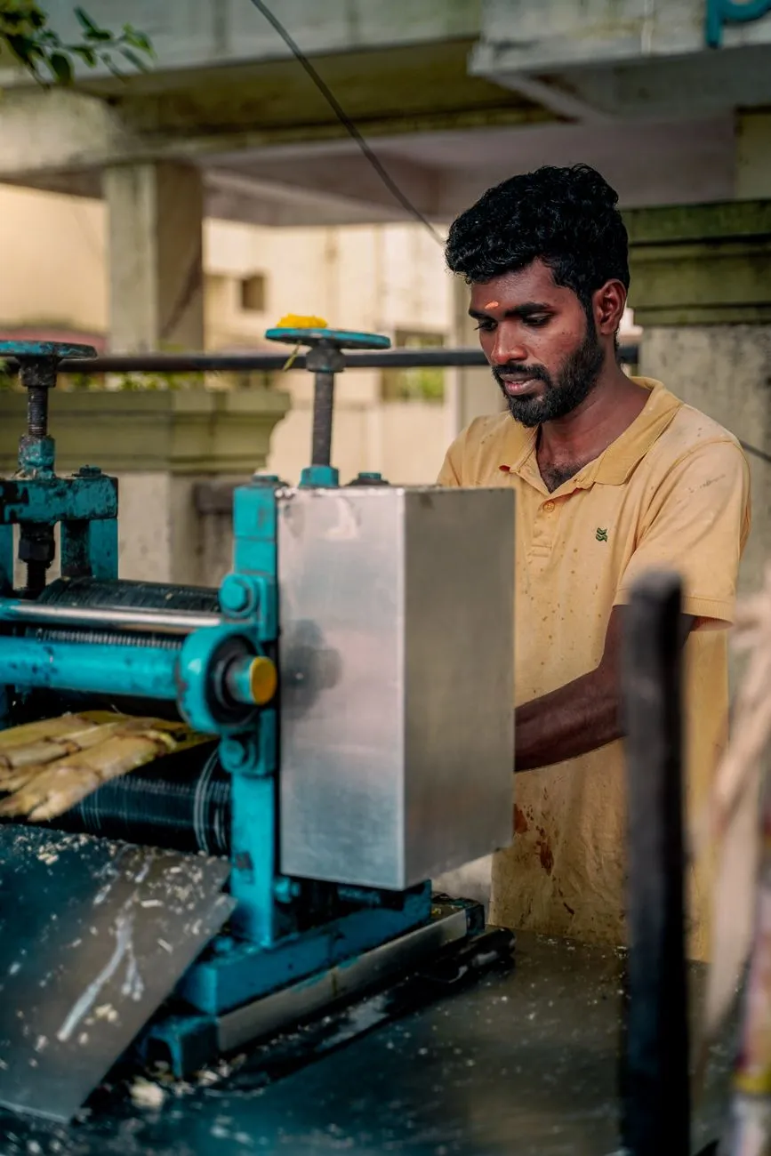 Fresh sugarcane juice vendor on a busy street
