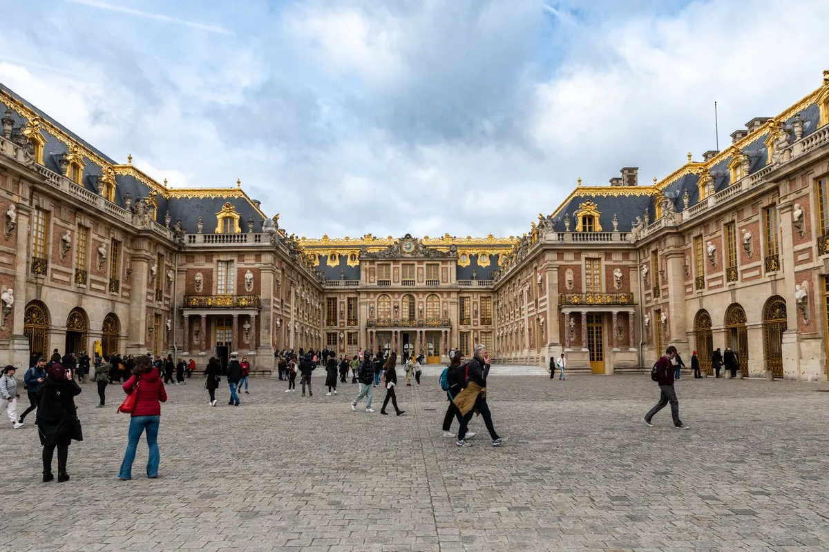The grand golden entrance of Versailles
