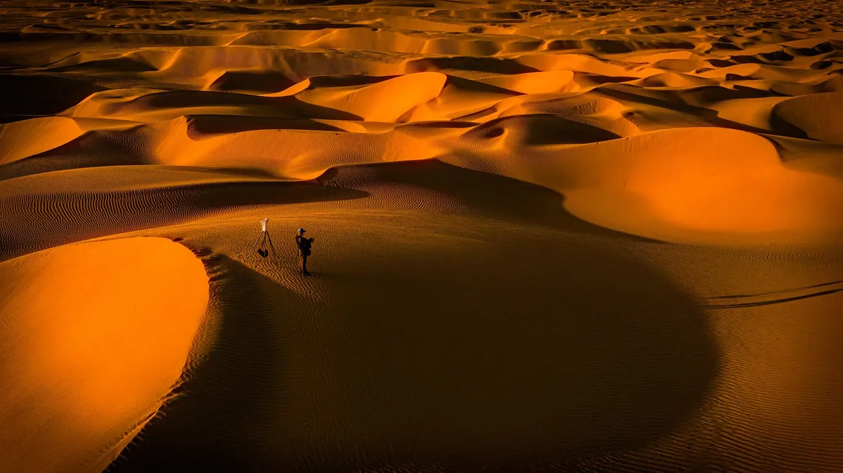 Young man looking at the desert horizon