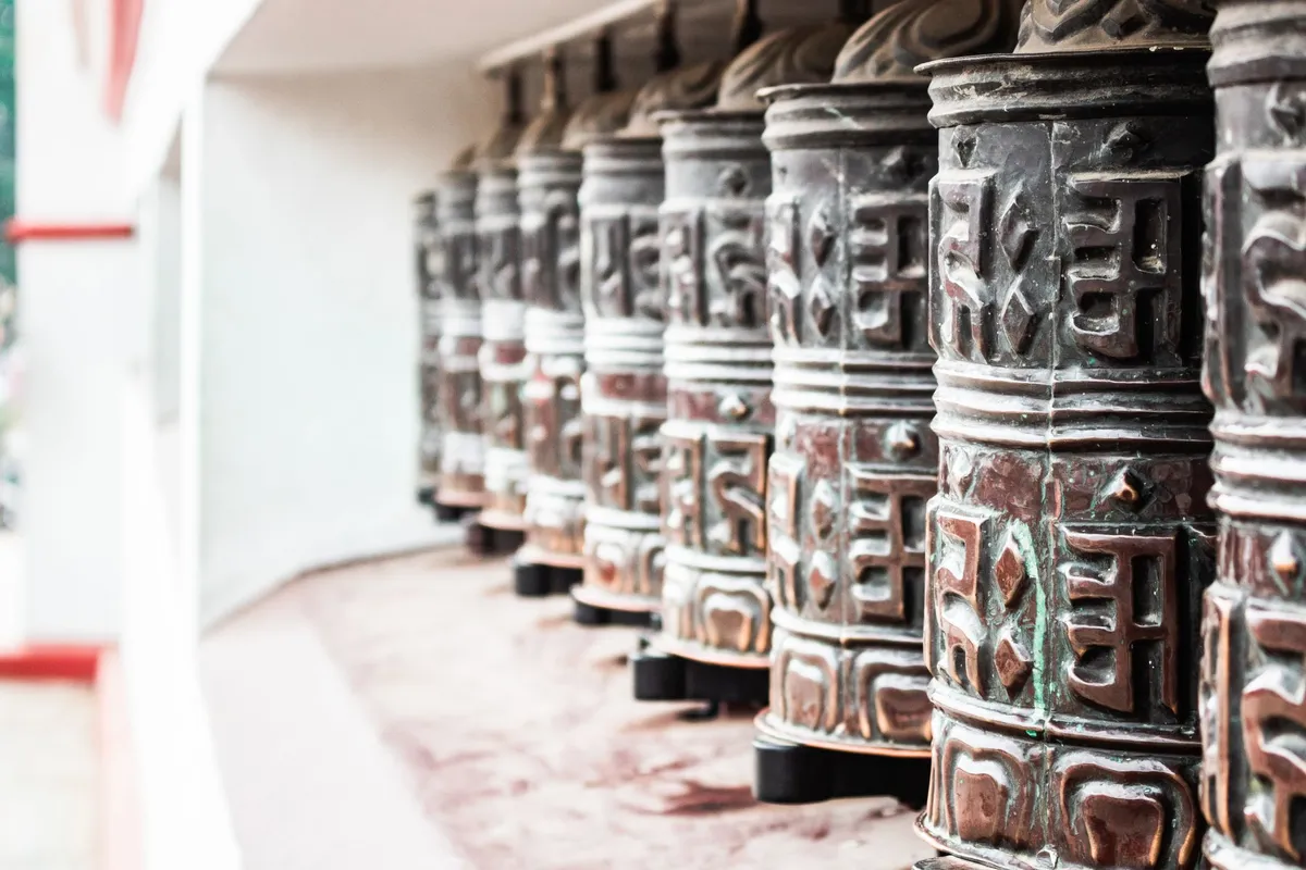 Intricate prayer wheels and temple architecture