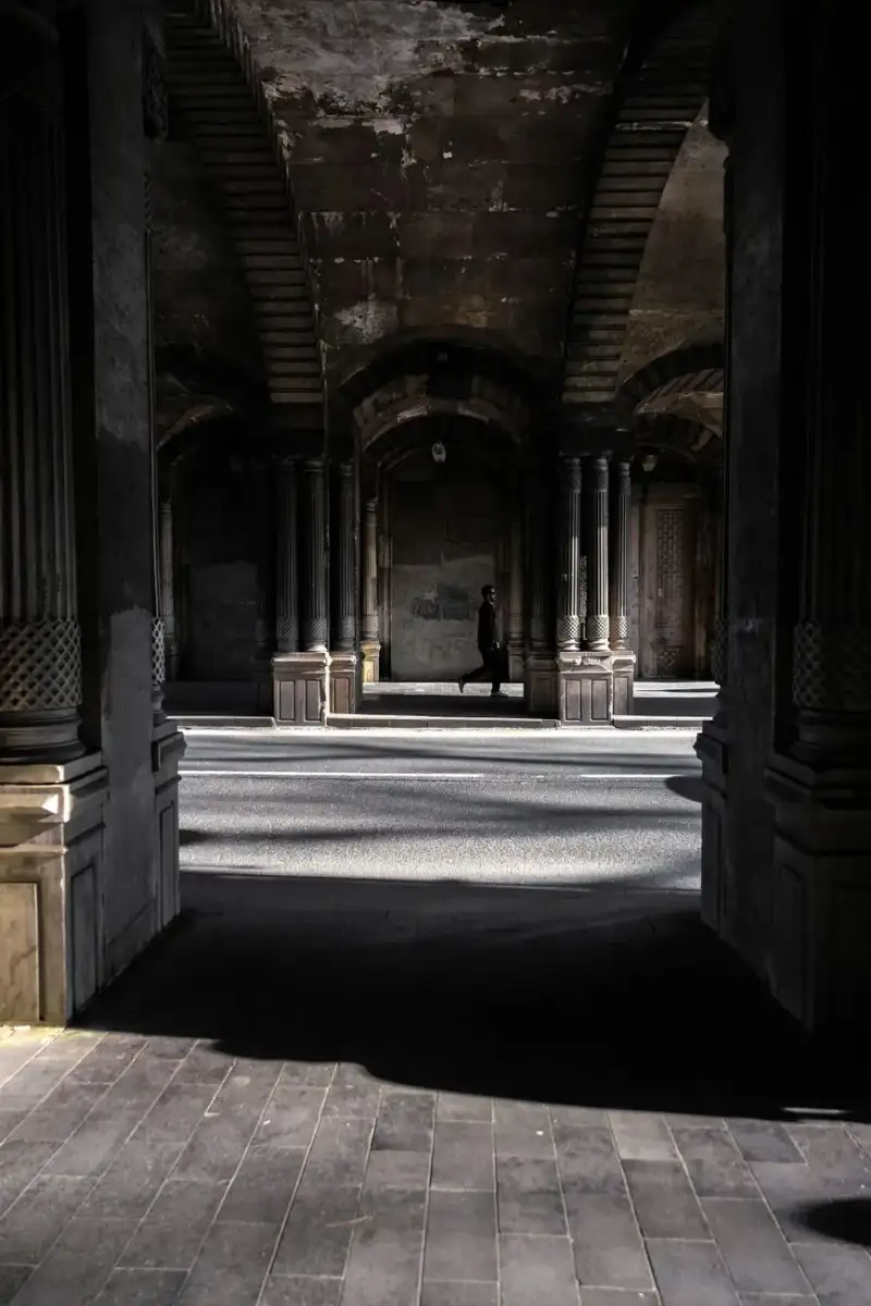Ancient stone architecture and dark gothic arches