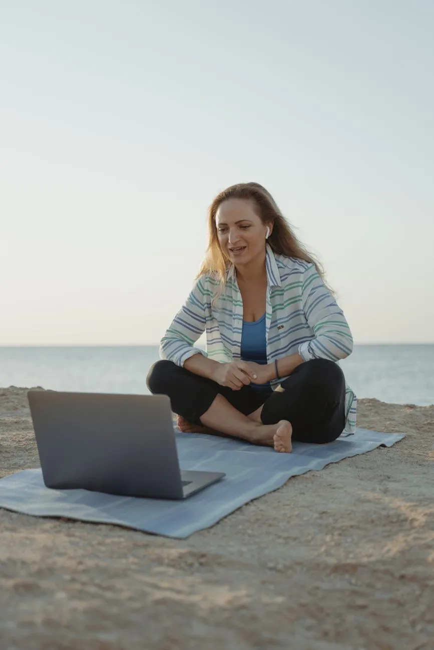 Sunset laptop silhouette on beach