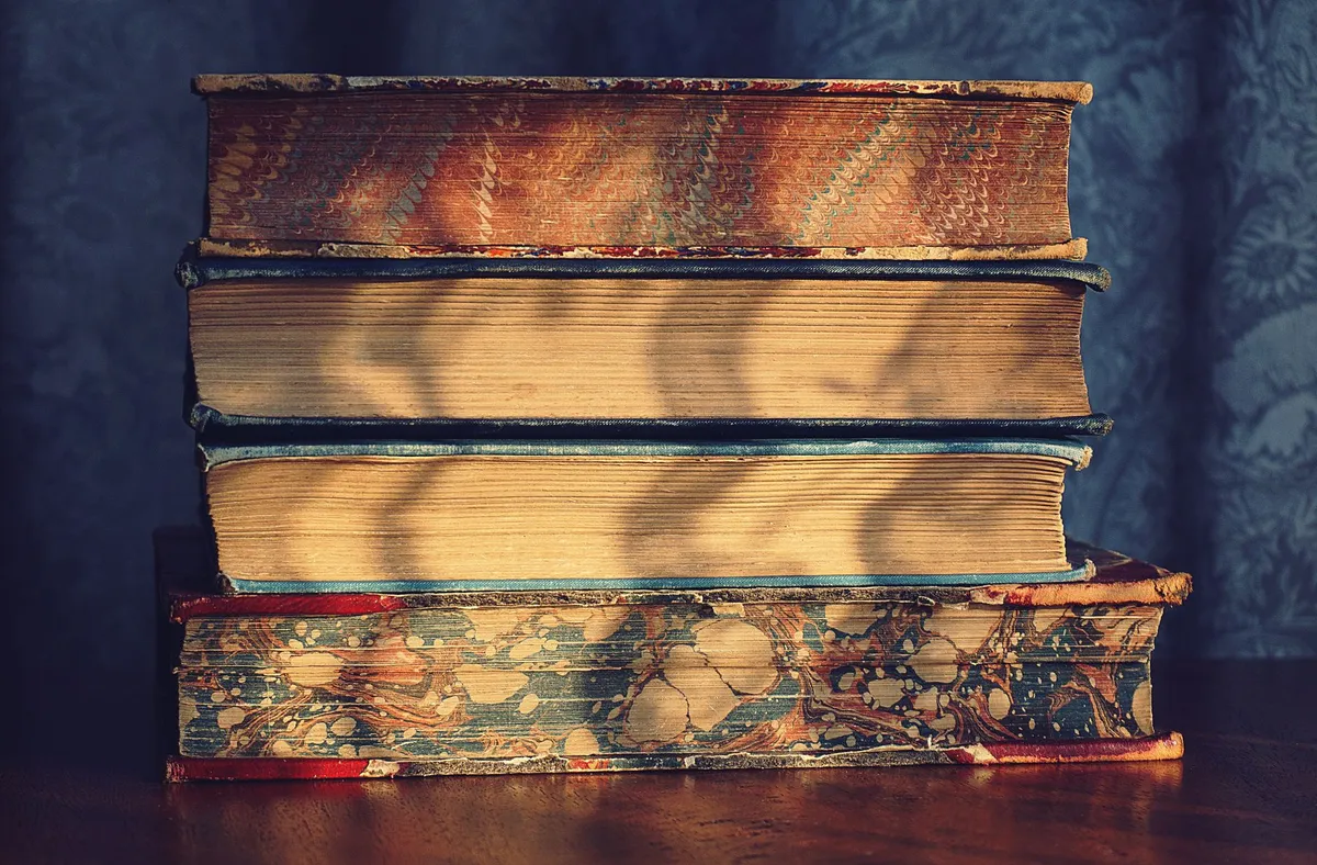Old dusty books in a dark room