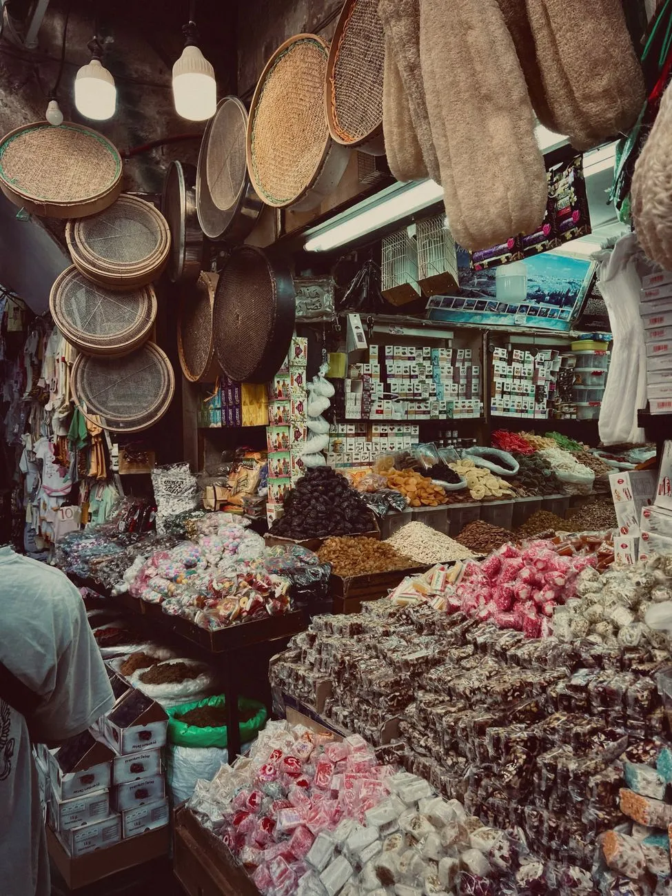 A bustling Beirut souk with vendors selling spices and olives