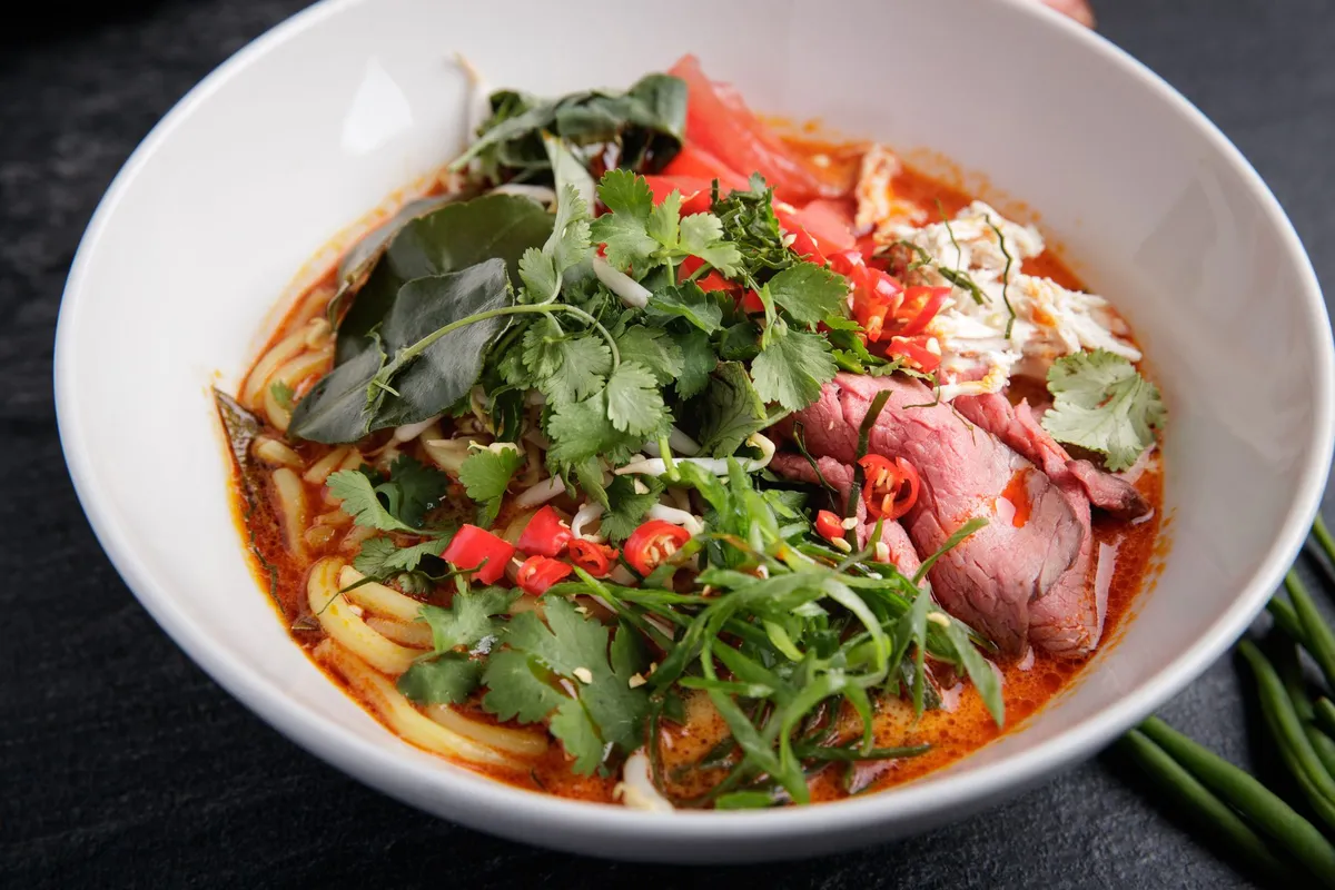 Malaysian Laksa: The Spicy, Creamy Noodle Soup That Defines Southeast Asia’s Culinary Soul