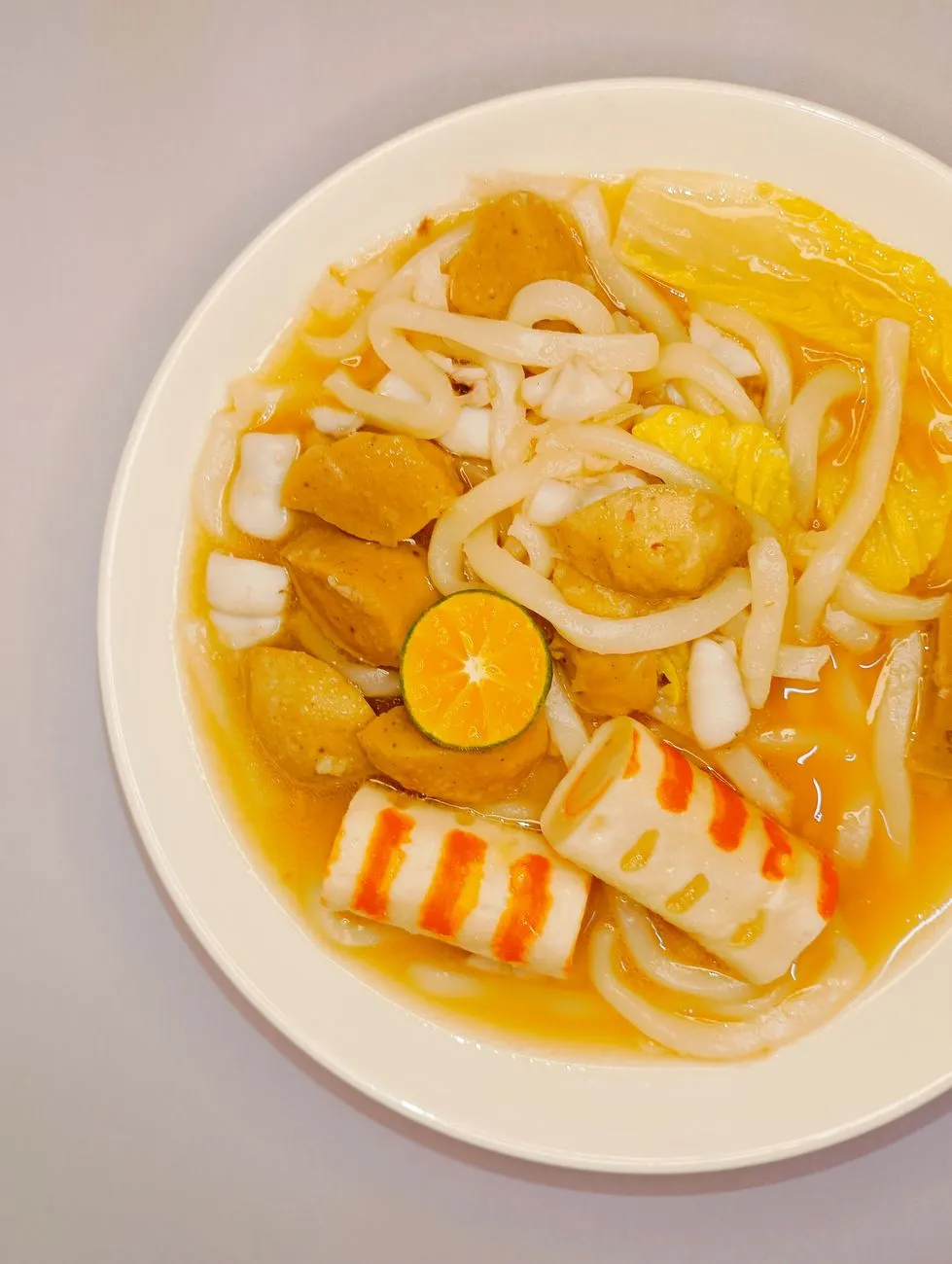 A Peranakan family preparing Laksa together