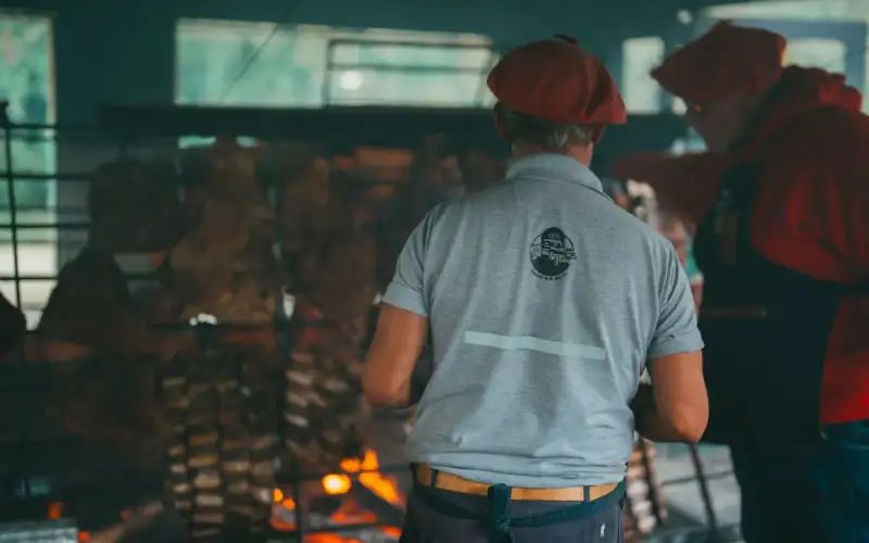 Gaucho cooking over an open flame