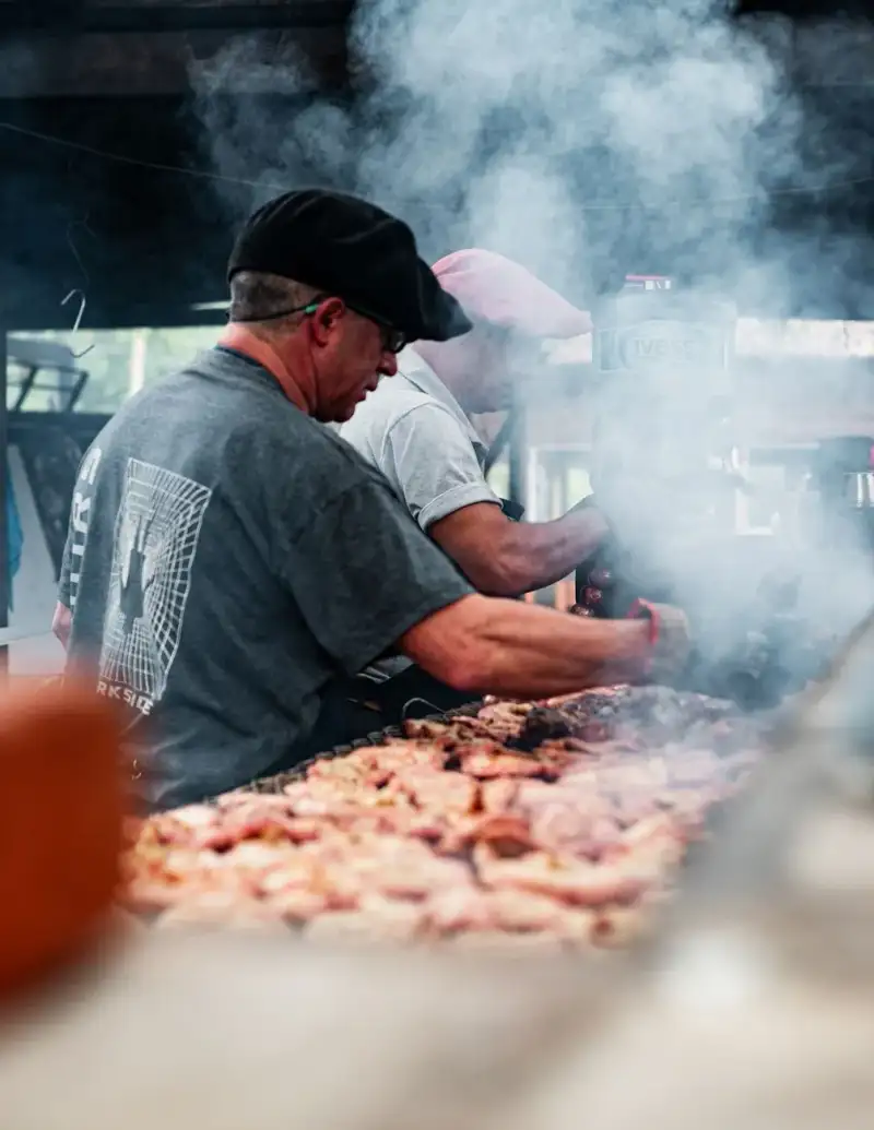Asador carving meat at an asado