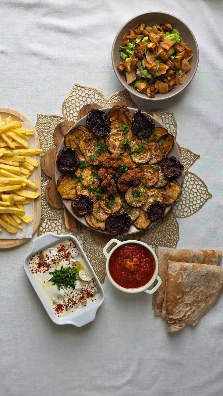 A colorful mezze spread with hummus, baba ghanoush, and falafel