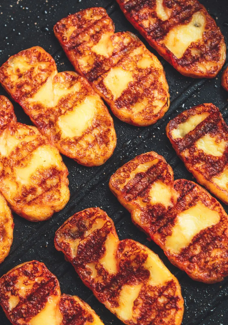 A close-up of a mezze platter with grilled halloumi and za'atar