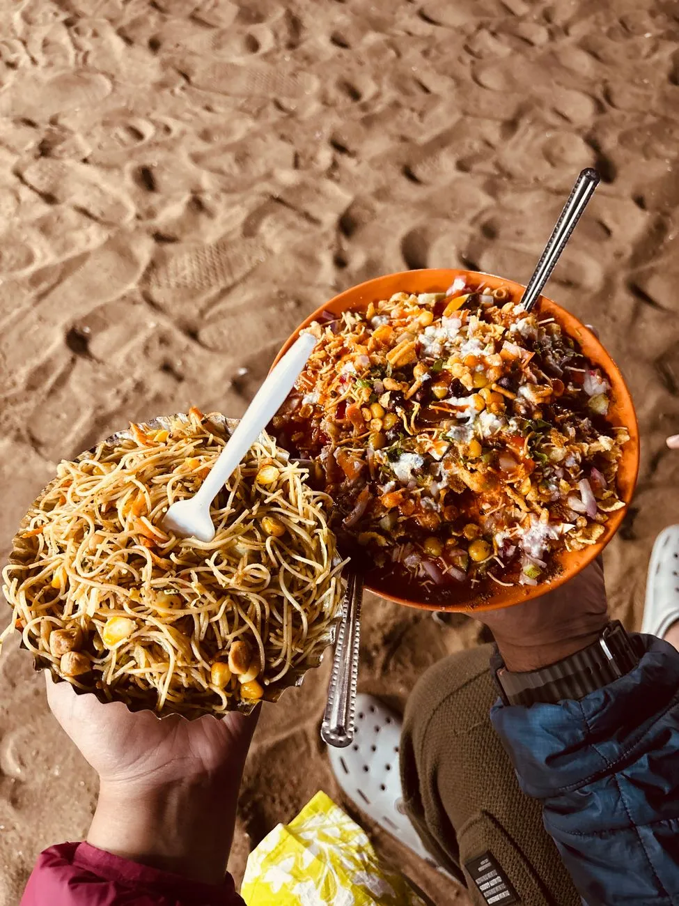 A busy street vendor preparing a mountain of Bhel Puri
