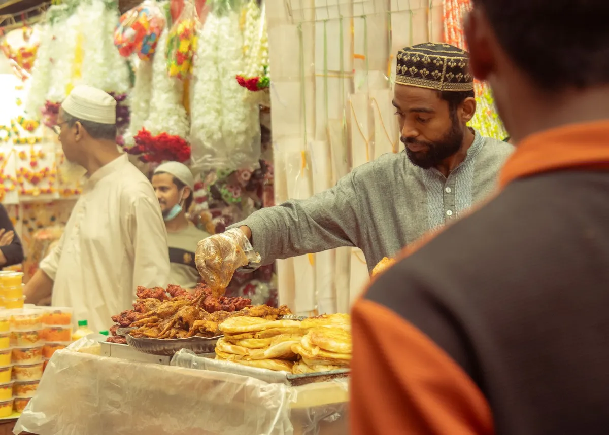 Mumbai street food vendor cooking vada pav