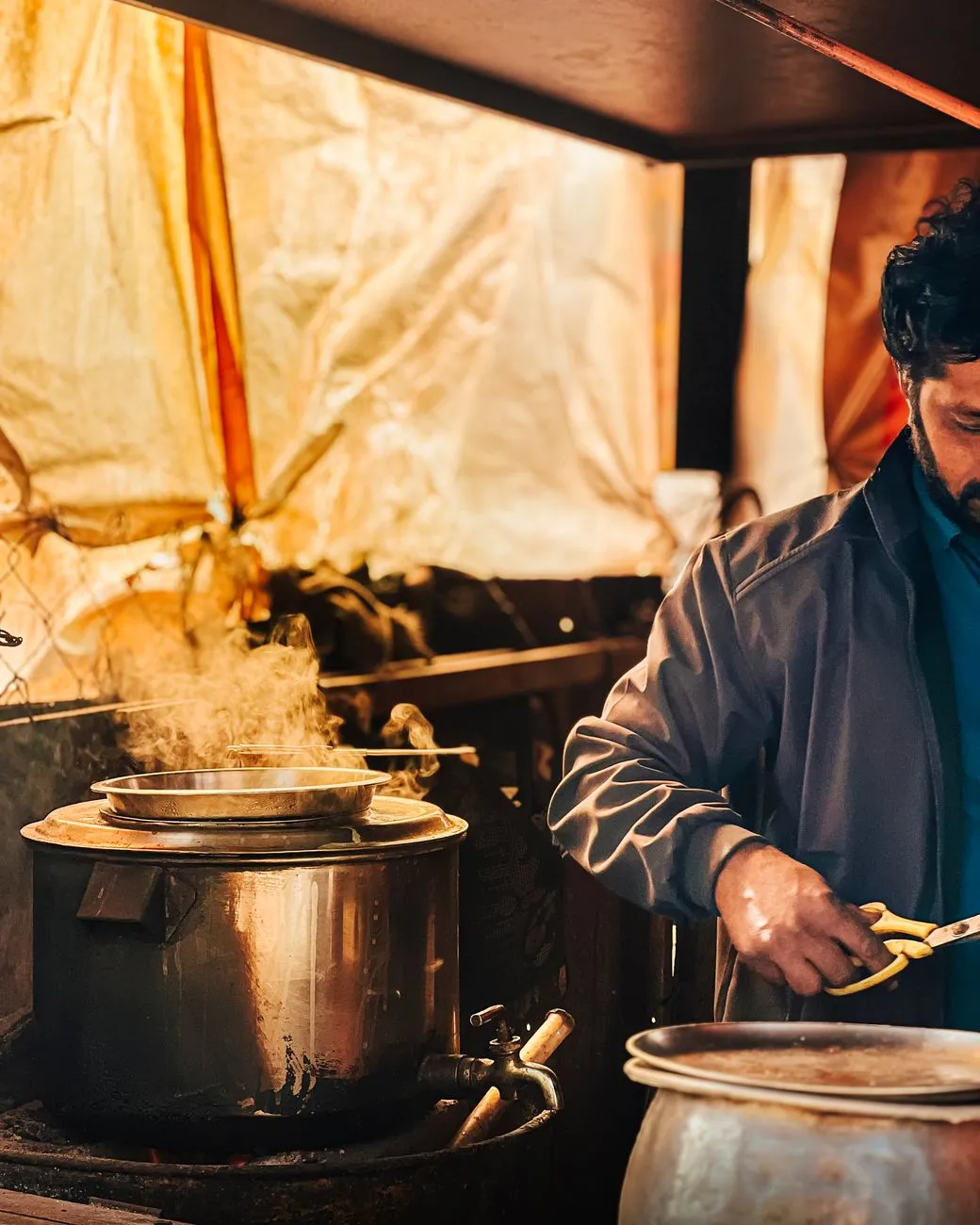 Vendor preparing pav bhaji on a hot tava